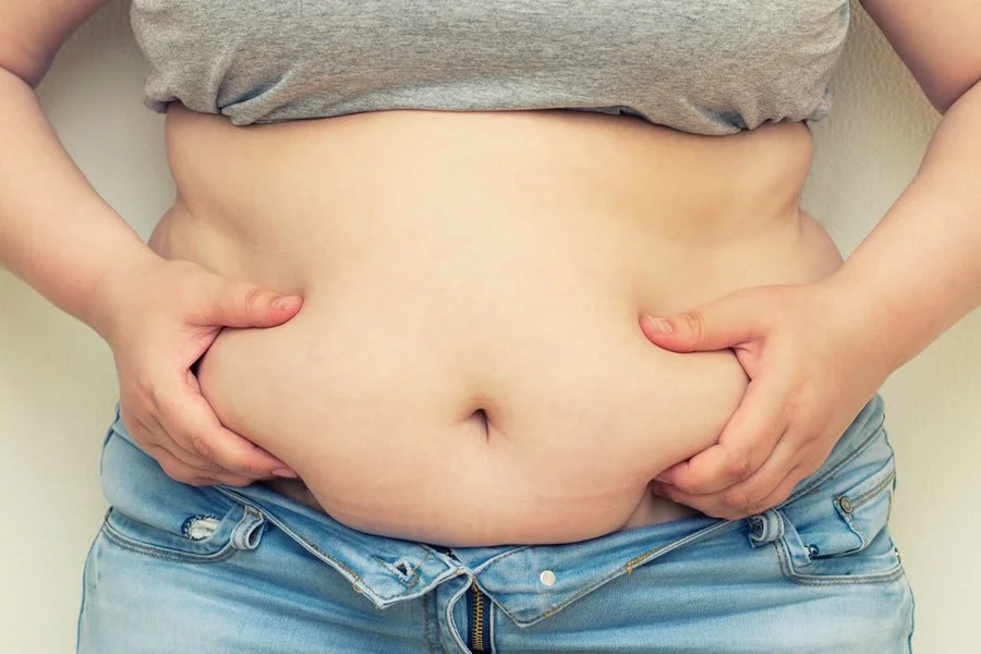 Closeup of a person with belly fat. We treat obesity naturally at lifeworks