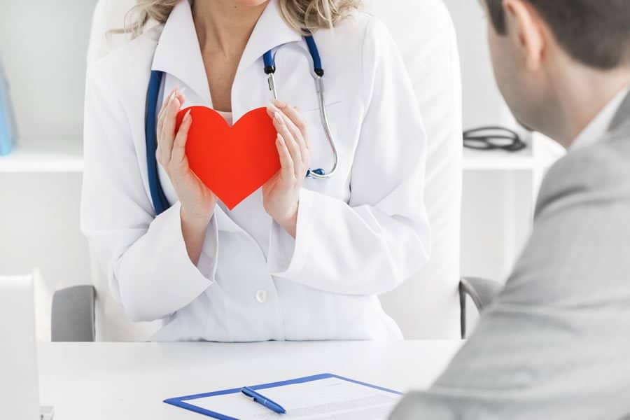 A doctor holding a small heart in her hands. We offer Heart Disease Therapies at LifeWorks