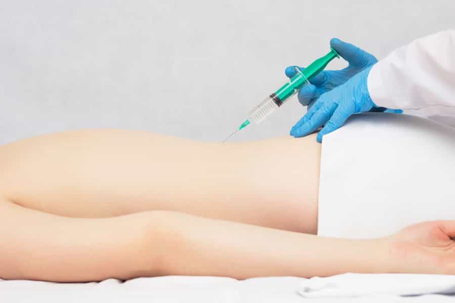 A person receving ozone therapy as an intramuscular injection