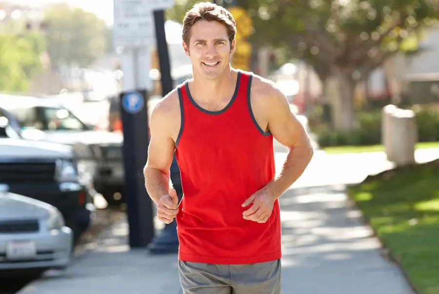 A healthy man running in the park. We treat prostate naturally