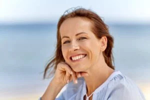 Happy woman after receiving treatment for thyroid disease