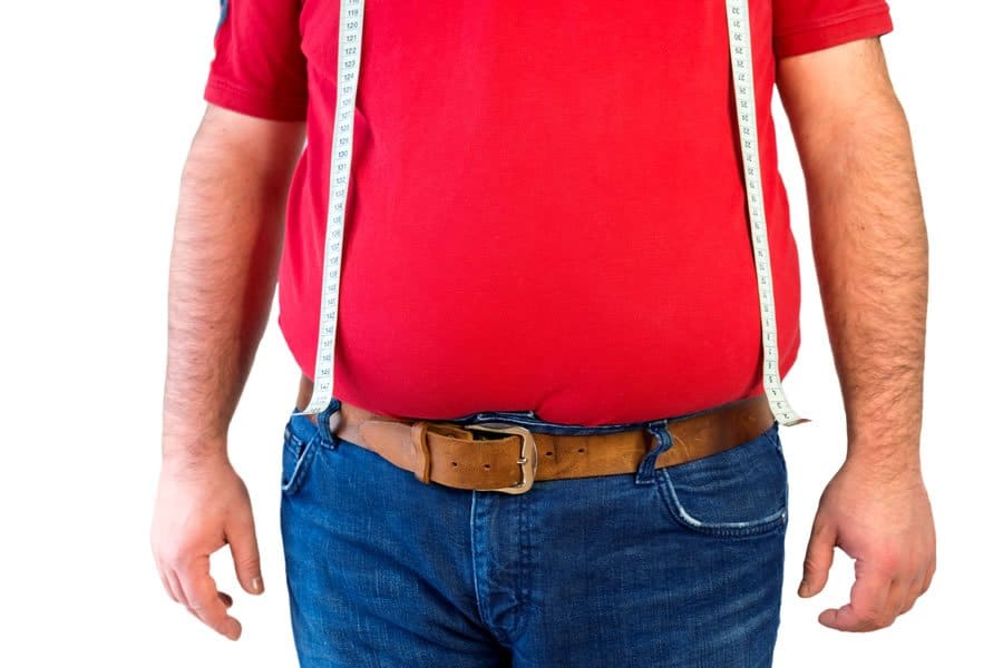 Man with belly fat suffering from Thyroid Conditions