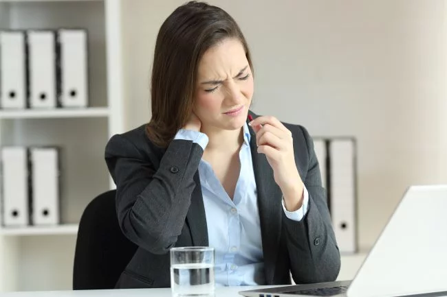 Business woman with hyperthyroidism symptoms