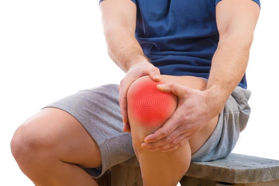 A man suffering from knee pain. We offer Prolozone Therapy sessions for severe aches and pains