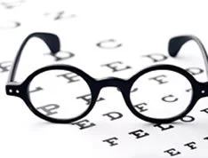 Patient's glasses on a vision test sheet.. Lifeworks offers efficient ozone therapy that can improve your vision