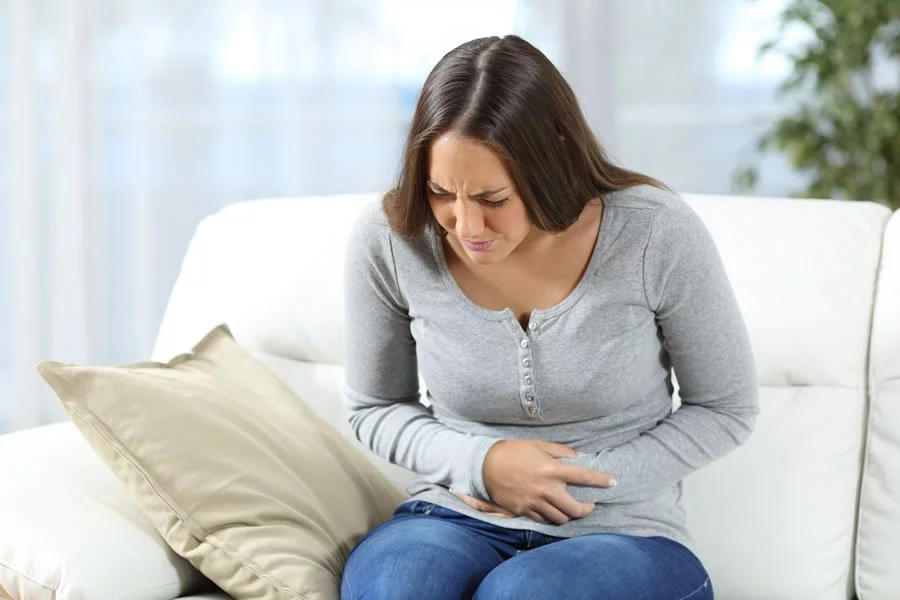 Woman with chronic pain needing gut disbiosis treatment