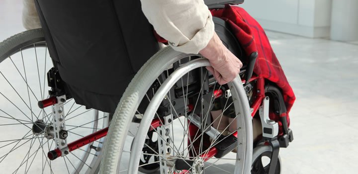 Man in his wheelchair, suffering from a chronic condition