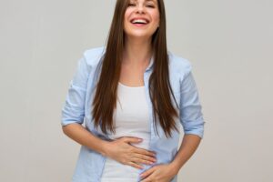 A Woman with a Happy Tummy. We offer natural leaky gut treatment