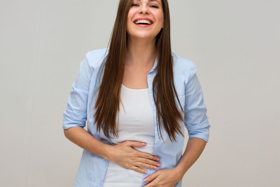 A Woman with a Happy Tummy. We offer natural leaky gut treatment
