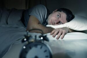 Person in bed with chronic fatigue issues