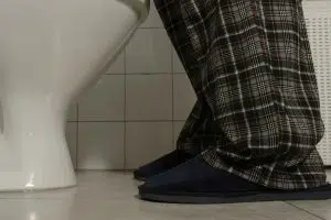 Man visiting restroom at night - prostate cancer risks