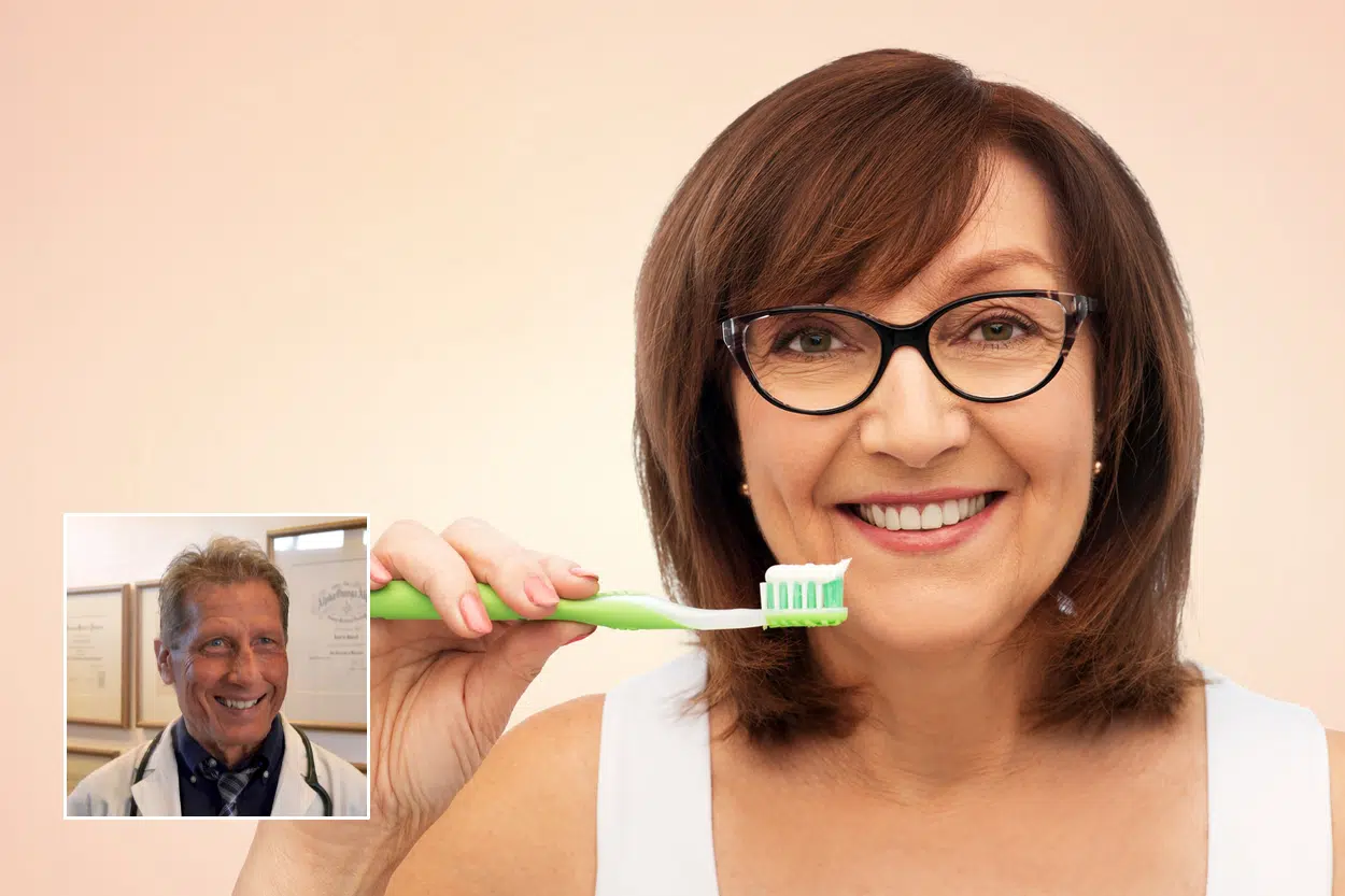 Mature woman brushing her teeth