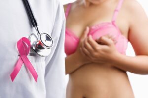 woman in pink top with doctor for breast cancer and ozone
